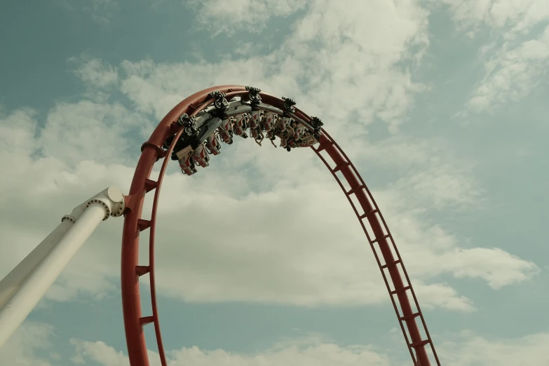 a roller coaster riding in a amut park