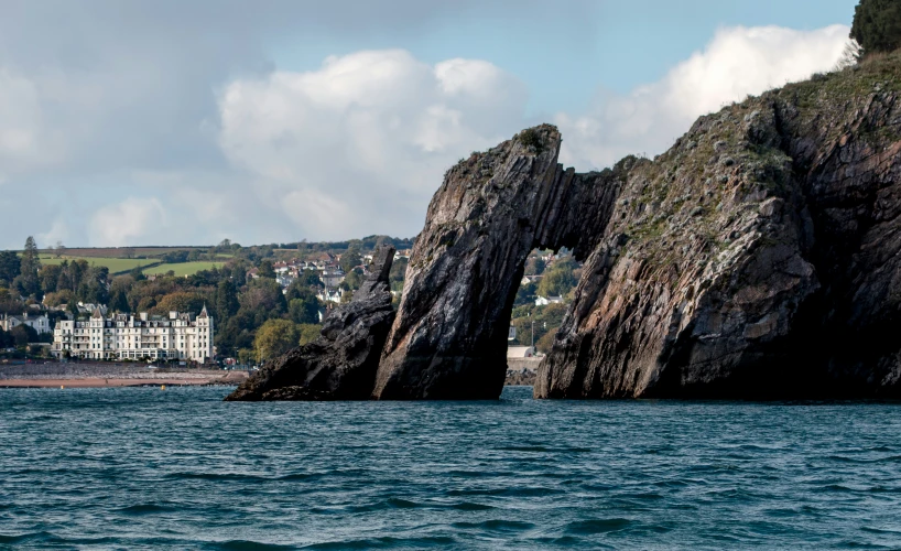 a rocky cliff with the ocean below