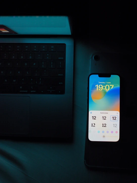 an iphone is shown next to a keyboard and mouse