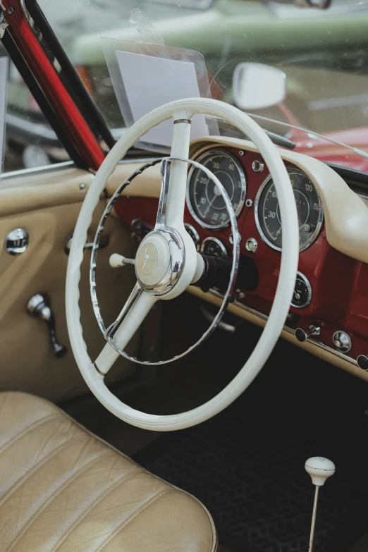 interior view of an old car with steering wheel and dashboard