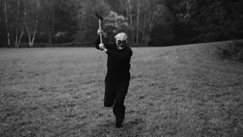 an old lady holding a bird in the middle of a field