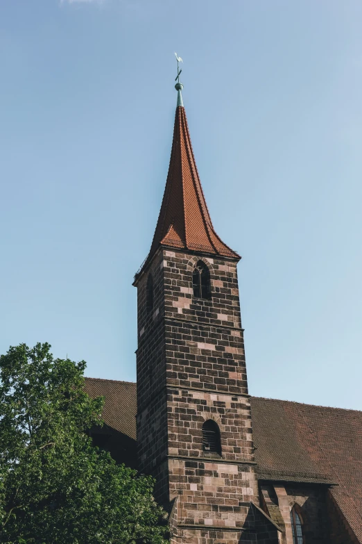 the tower on the top of a church with clocks