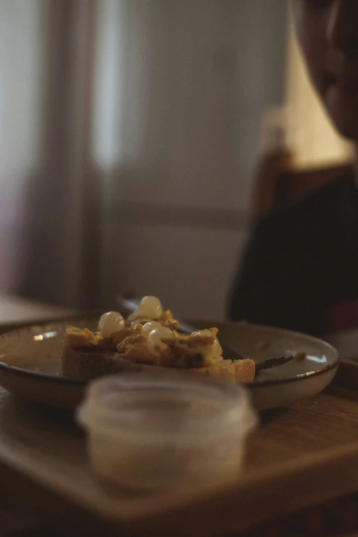 a close up of someone on the table eating food