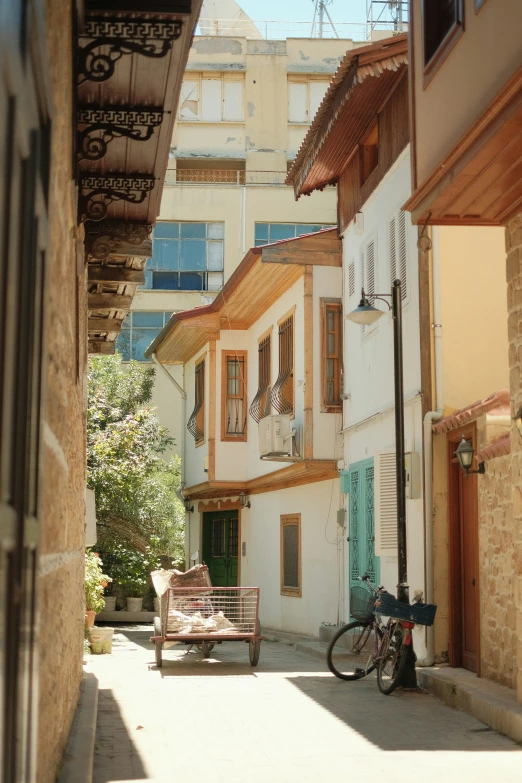 there are several buildings in the street lined with bicycles