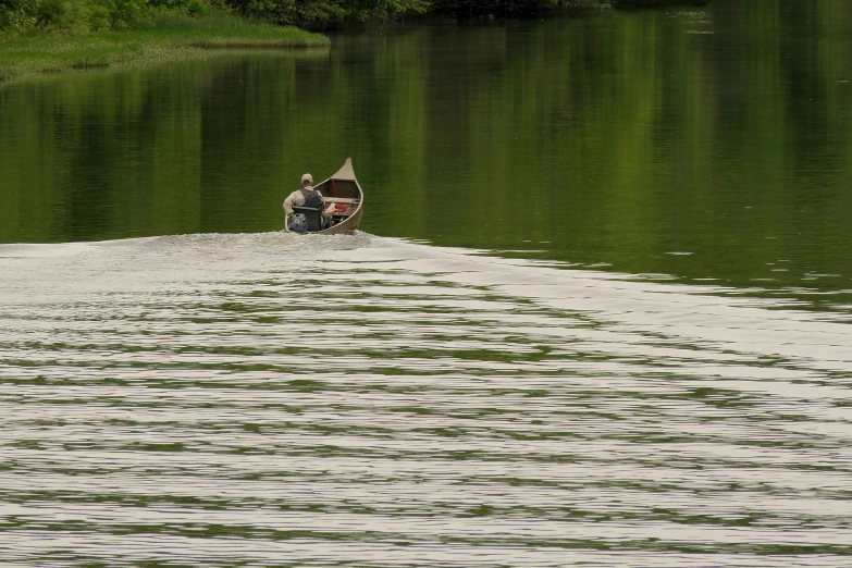 a person riding in a boat on the water