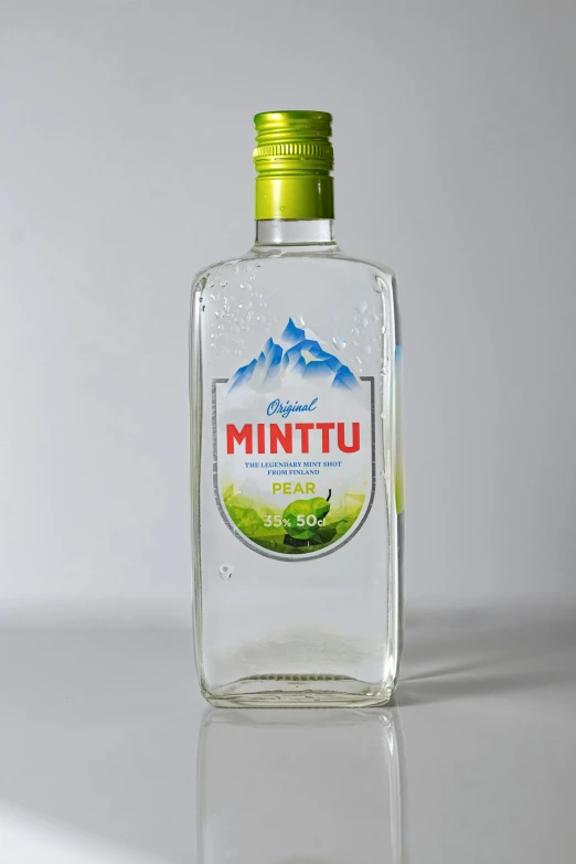 bottle of vodka with green cap and white background