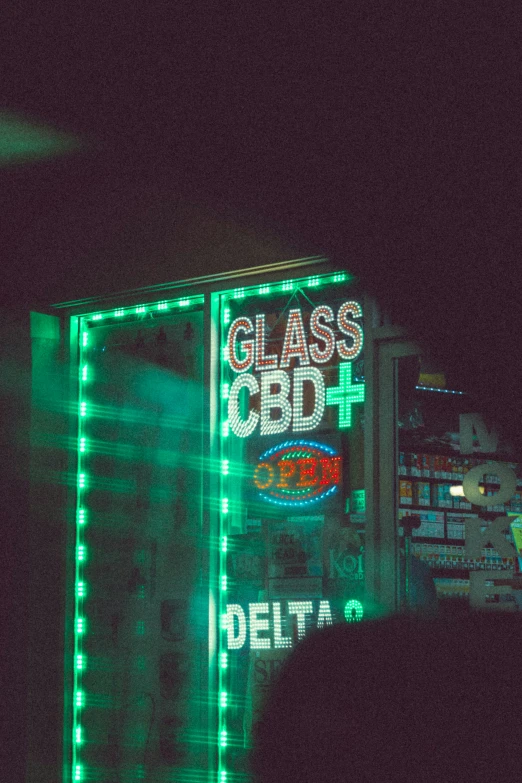 a bar sign that is lit up in the dark