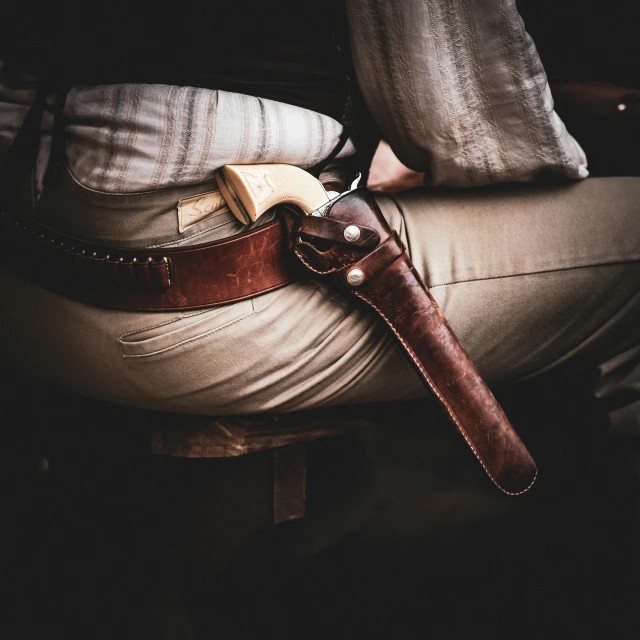 an assortment of different types of knives on a chair