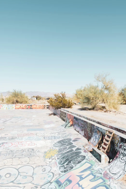 an empty park that is full of graffiti