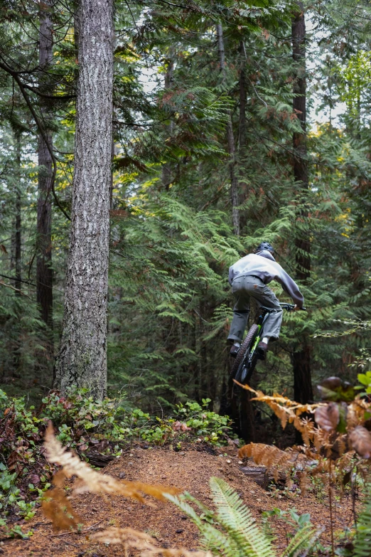 a man jumping a ramp in the air on a bike