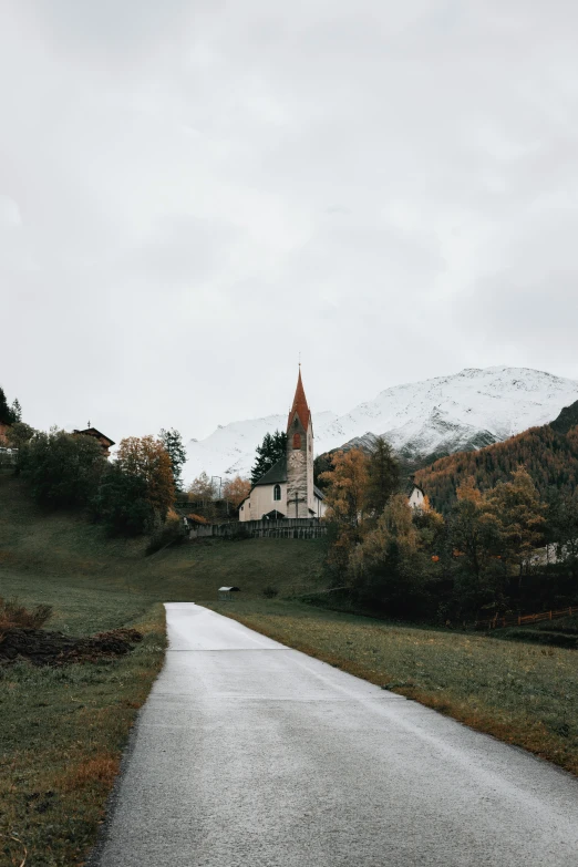 the pathway leads to an old, rundown church