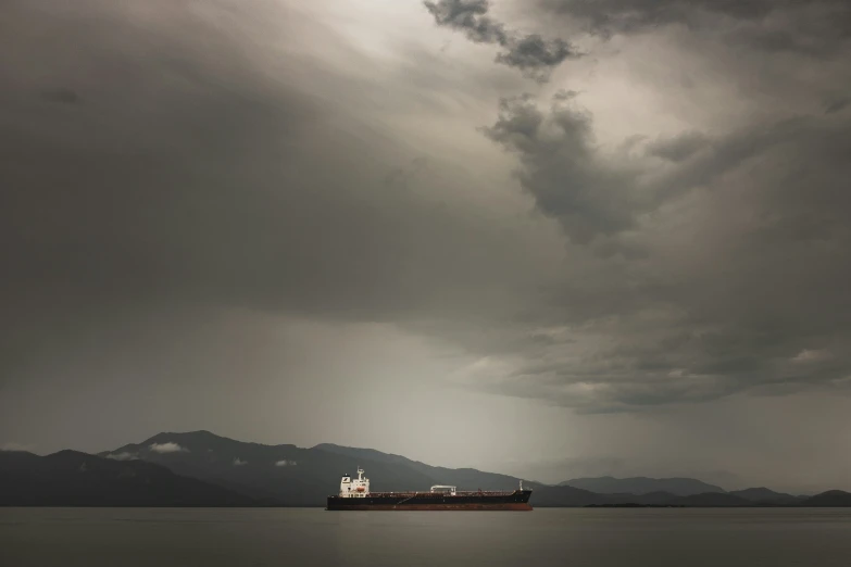 a large cargo ship is on the ocean