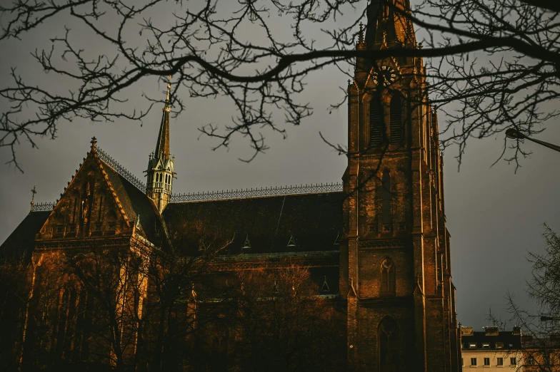 a church at night with the steeples illuminated up