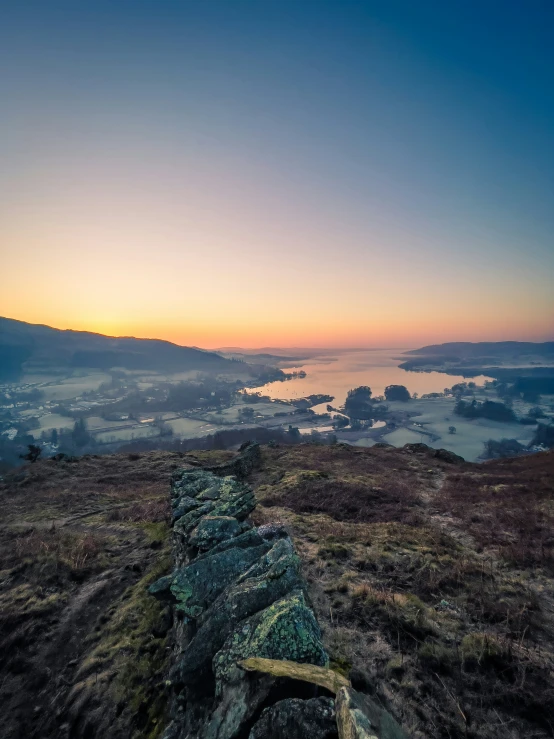 an image of a bench that is on top of a hill