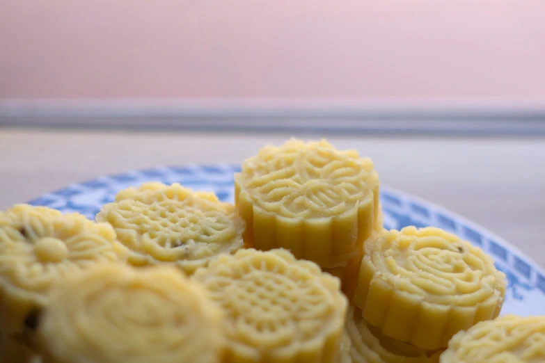 several small biscuits sitting on top of a plate