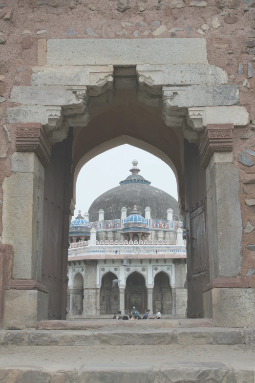 an open archway leading into a large building