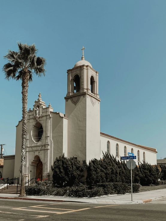 a big building with a cross on the top of it