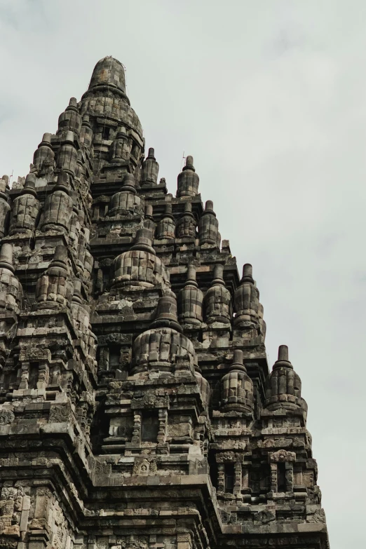 an old stone structure that is built with statues