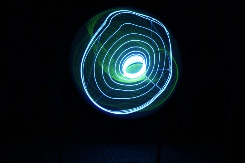 a black background with a glowing spiral design