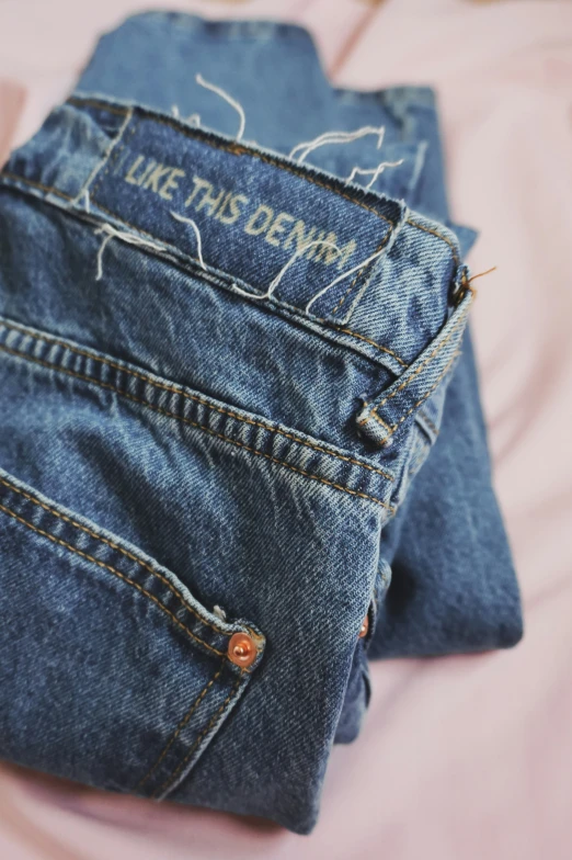 two pairs of jeans that are written like this denims