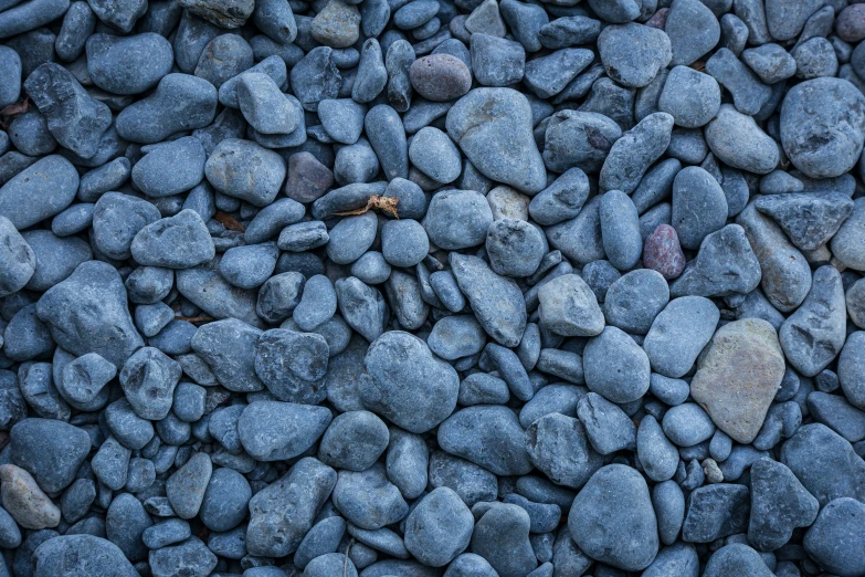 a rock pile has lots of gray rocks and pebbles