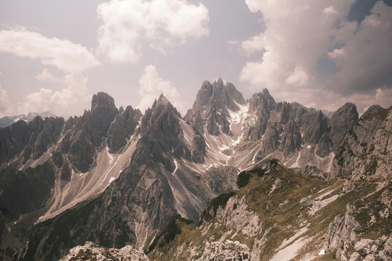 the mountains are in the clouds during the day