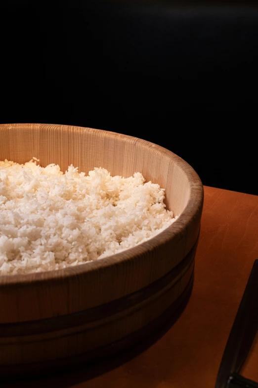 there is rice in the bowl on the table