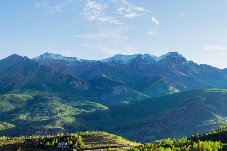 a bunch of snow capped mountains in a valley