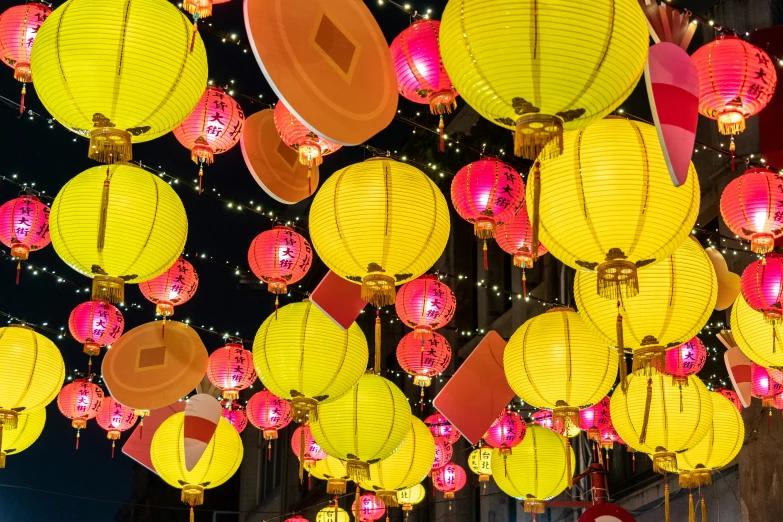 colorful paper lanterns are on display against the sky