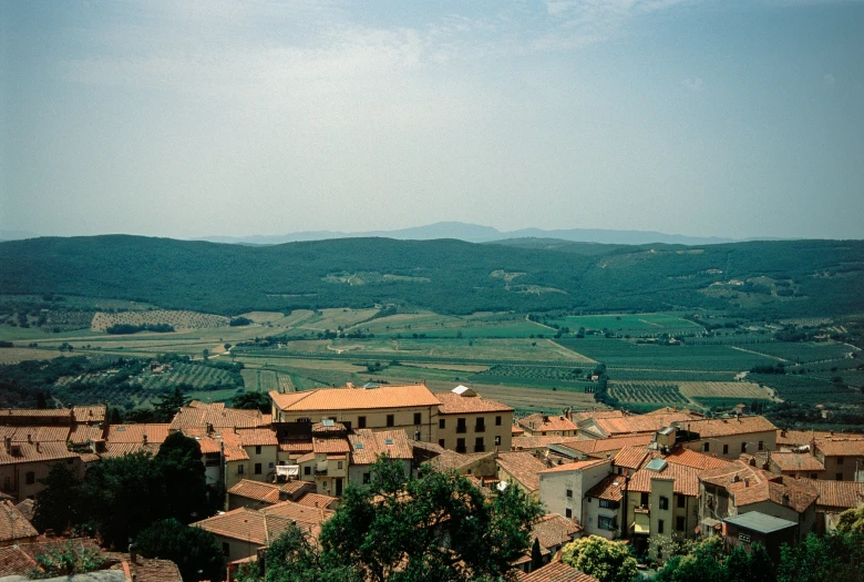 a small town sits in the middle of an expansive valley