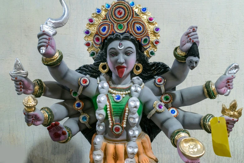 a statue of a hindu idol is being displayed