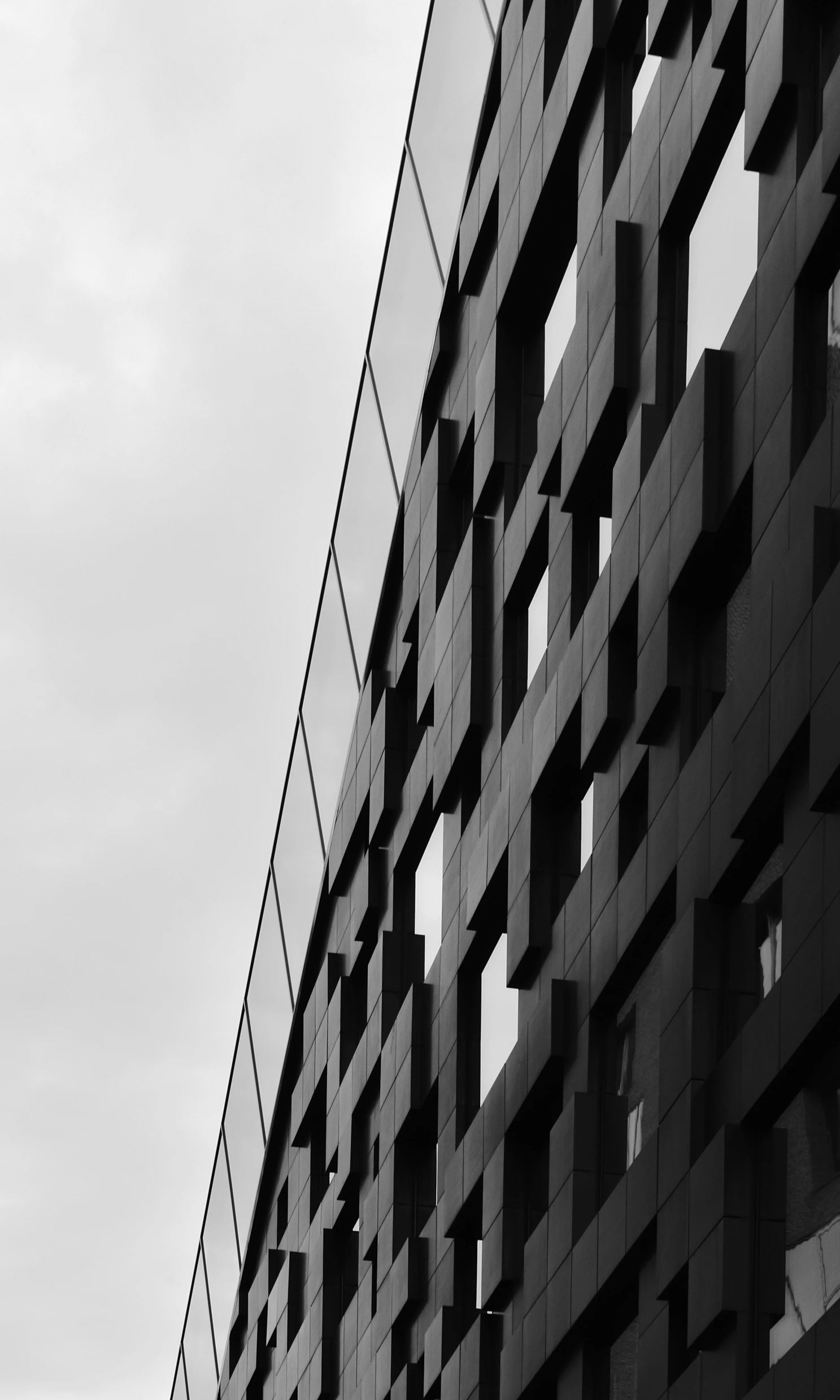 black and white pograph of abstract architecture on cloudy day