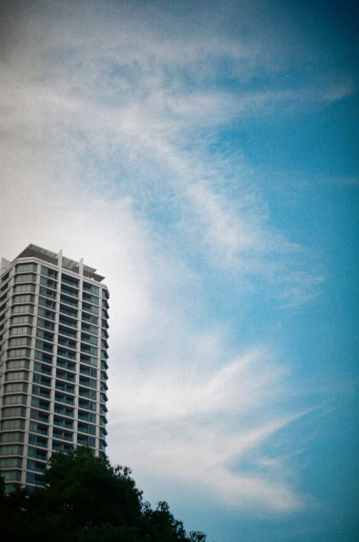 the tall building with the sky in the background