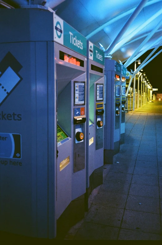 a row of vending machines with their doors open