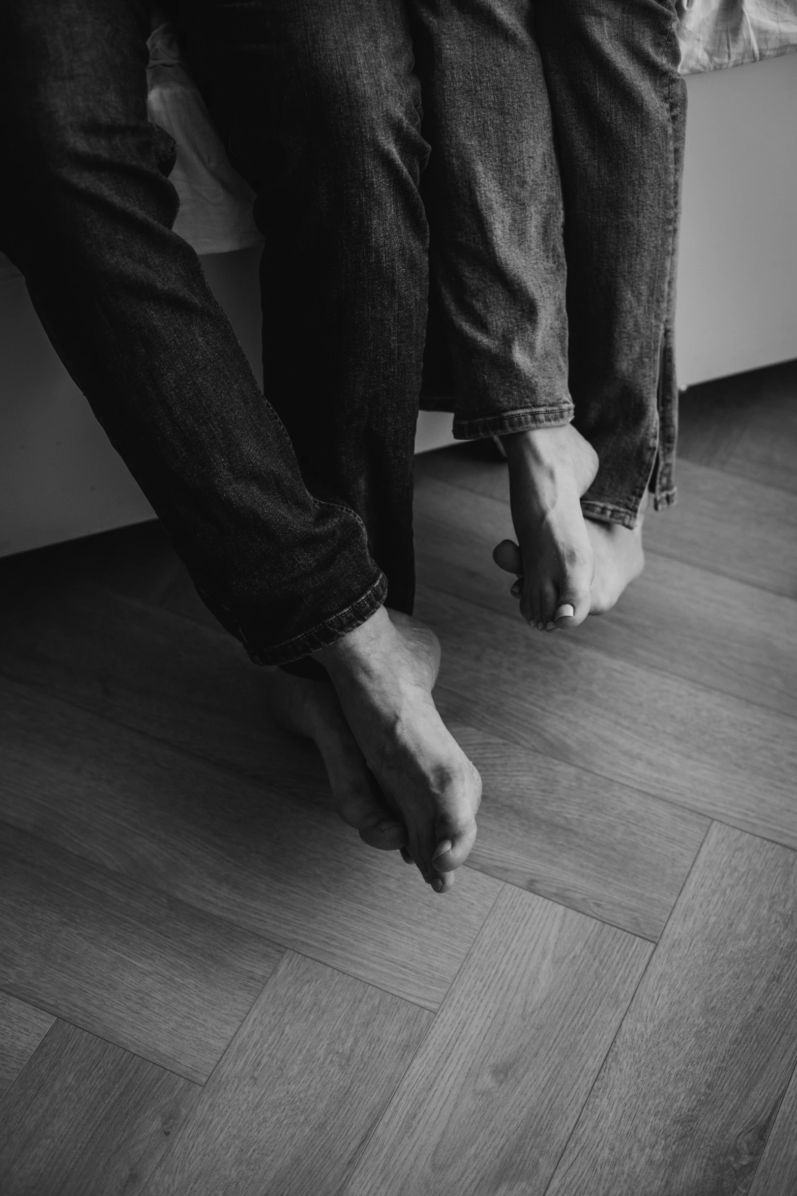 black and white image of two legs on someone's feet