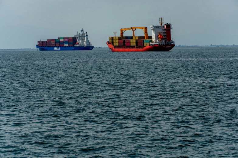 there is a large boat and a smaller one sitting in the water