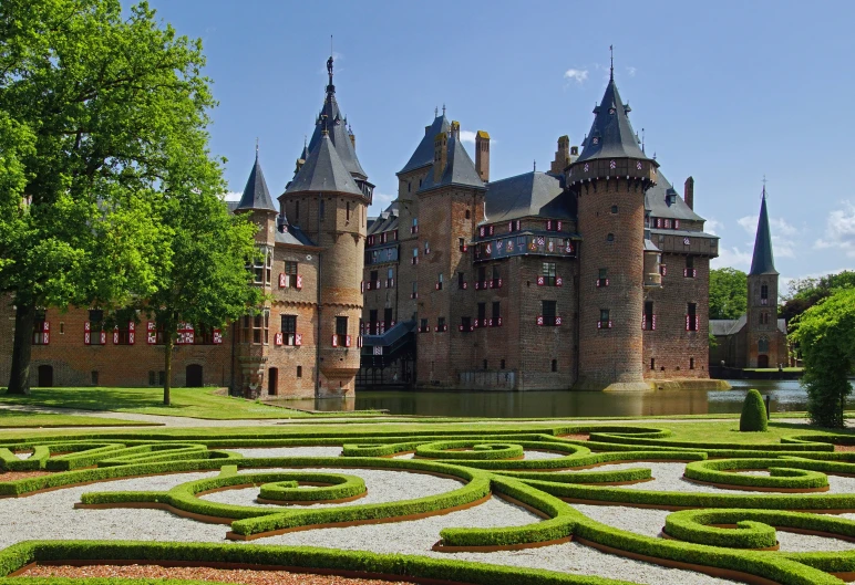 a building with a large tower in a garden