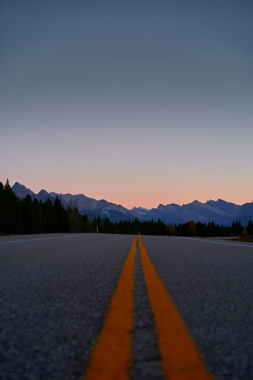 an orange line painted in the middle of the road