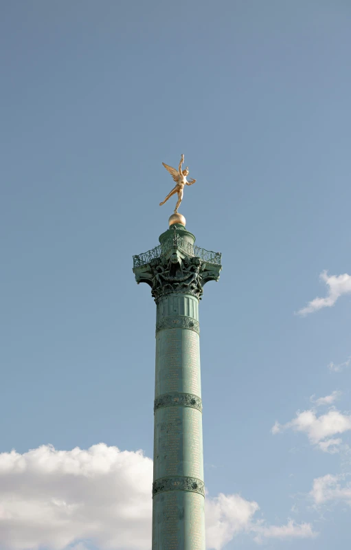 a monument with a man on top of it