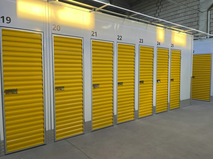 several rows of yellow doors at a storage building