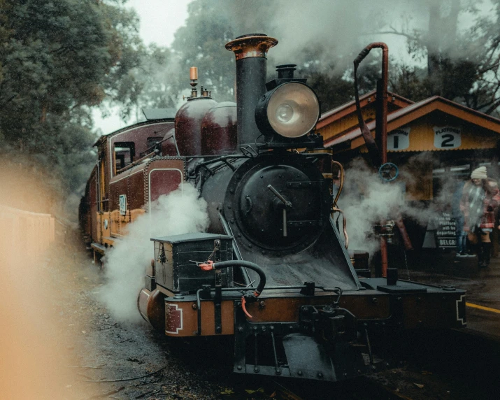 a steam engine with steam pouring out of it