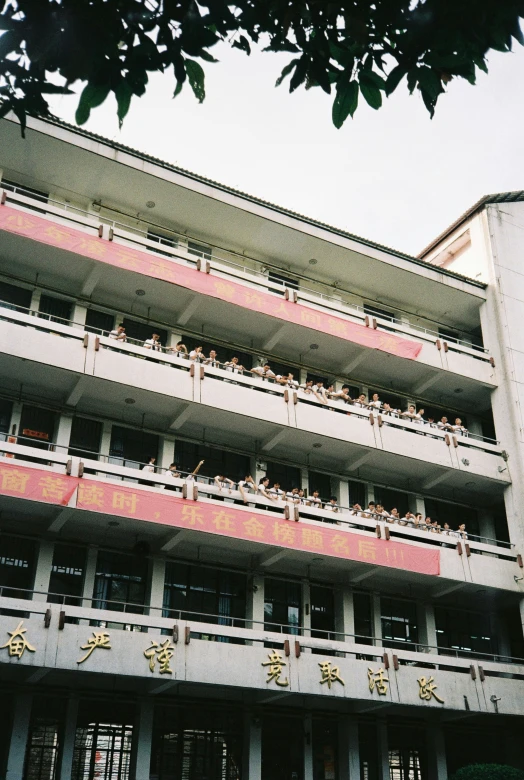 the building is a unique looking structure with asian writing on the sides