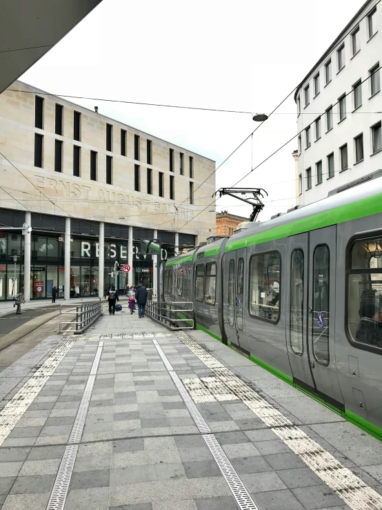 a long gray train on display at a station