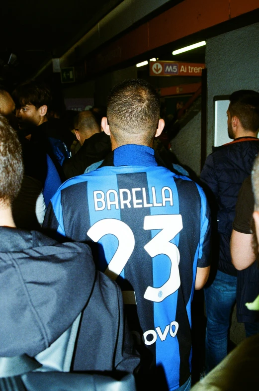 some very nicely dressed soccer players in a large crowd