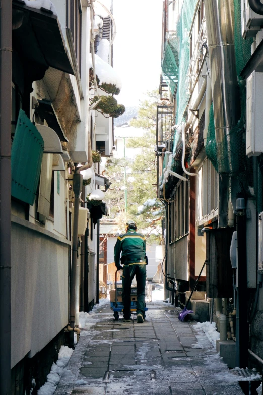 a man and child walking down an alley