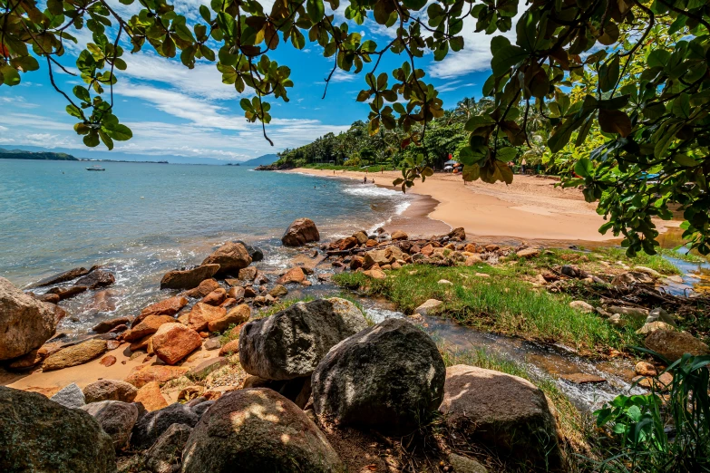 an empty beach on the edge of the ocean