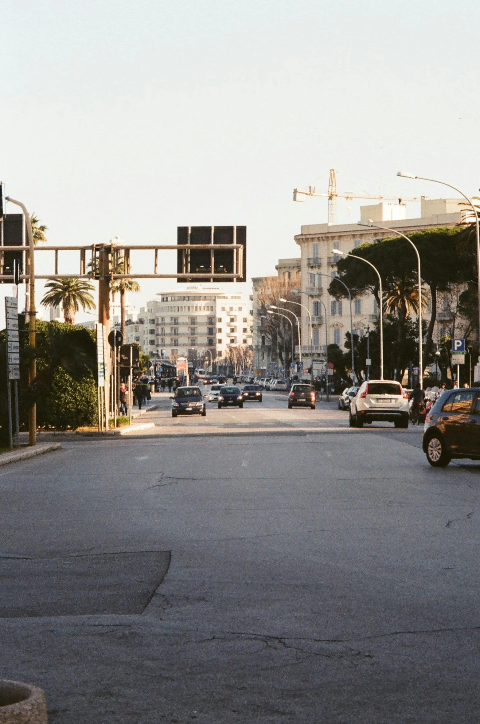 a street filled with lots of traffic on top of a road