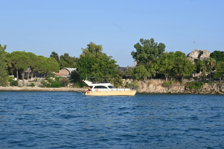 there is a white boat floating in the water