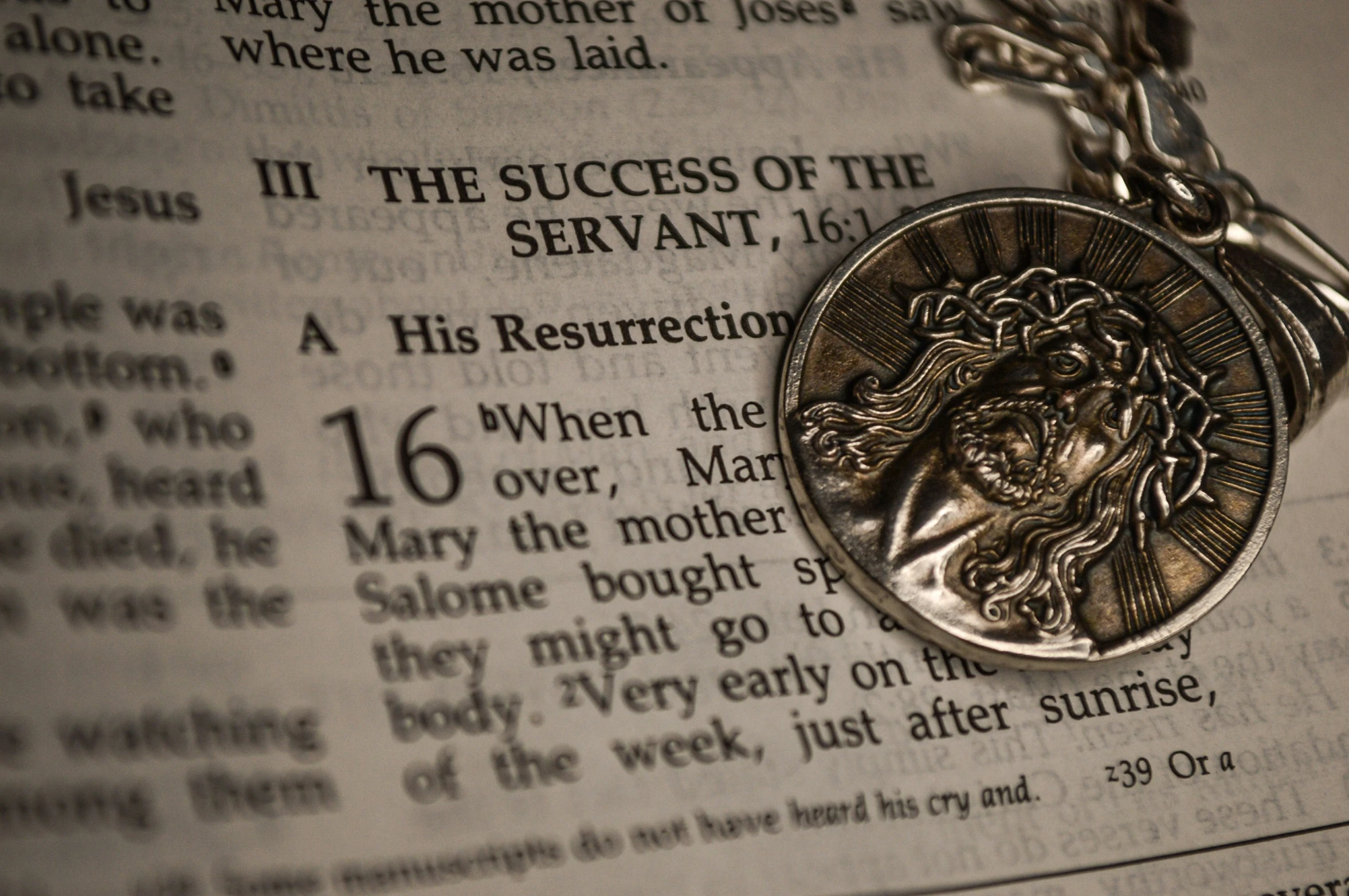 a medallion that is laying on top of a book