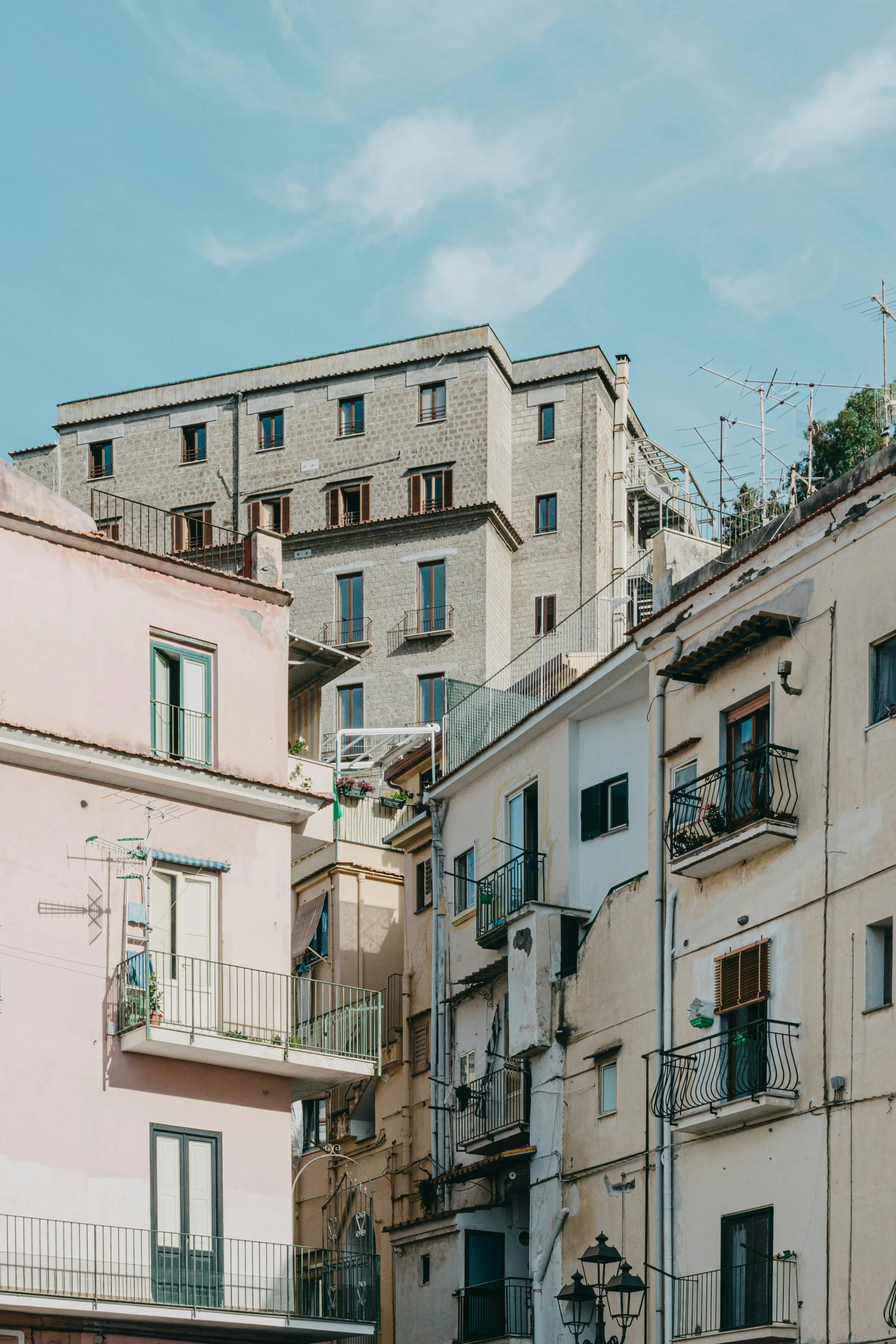 a group of buildings on the side of a street